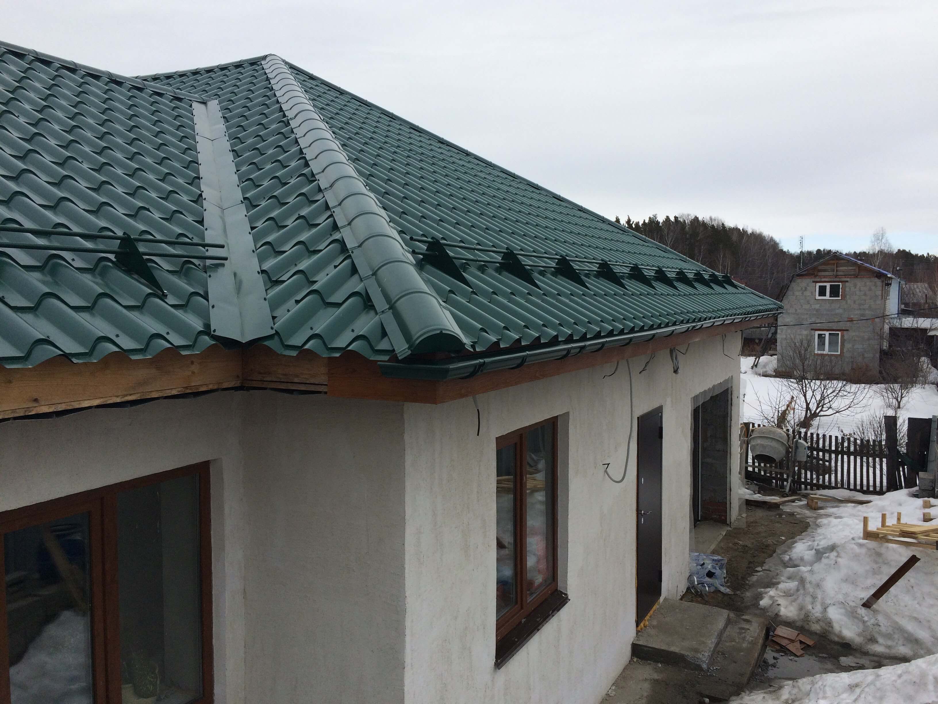 Дом из газоблоков с облицовкой штукатуркой