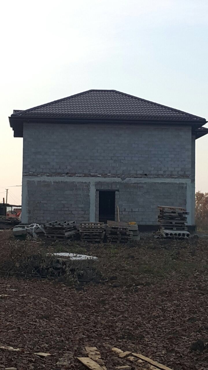 Дом из керамзитоблоков с облицовкой штукатуркой